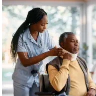 caregiver assisting an elderly