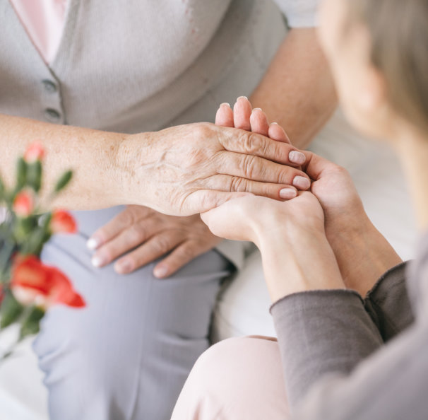 pair of hands holding each other