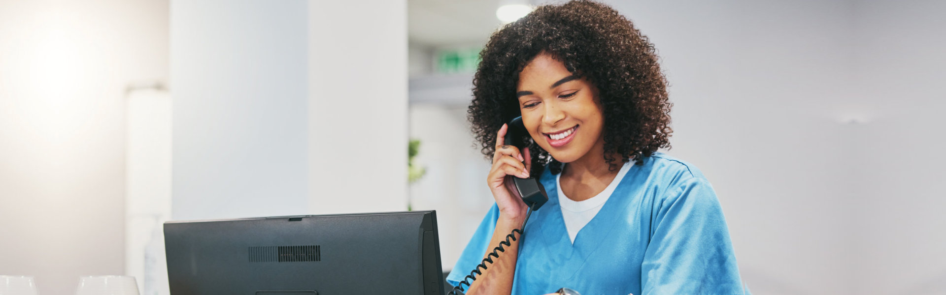 A healthcare worker talking on the phone