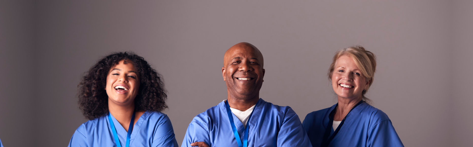 three caregiver smiling